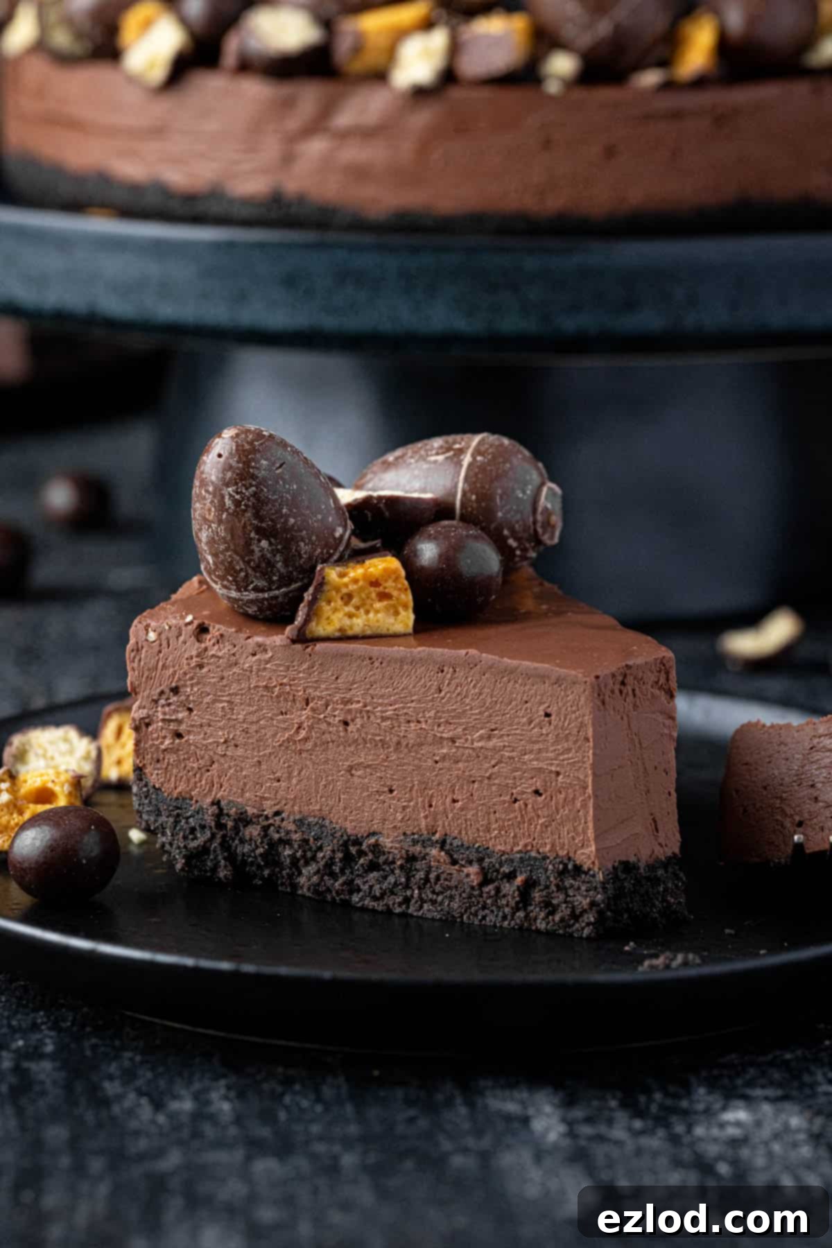 Velvet Vegan Chocolate Cheesecake 4 A slice of vegan chocolate cheesecake on a black plate.