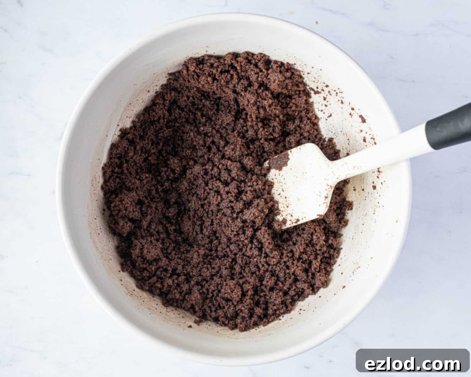Velvet Vegan Chocolate Cheesecake 6 Step 2, the cookie crumbs with the butter added.