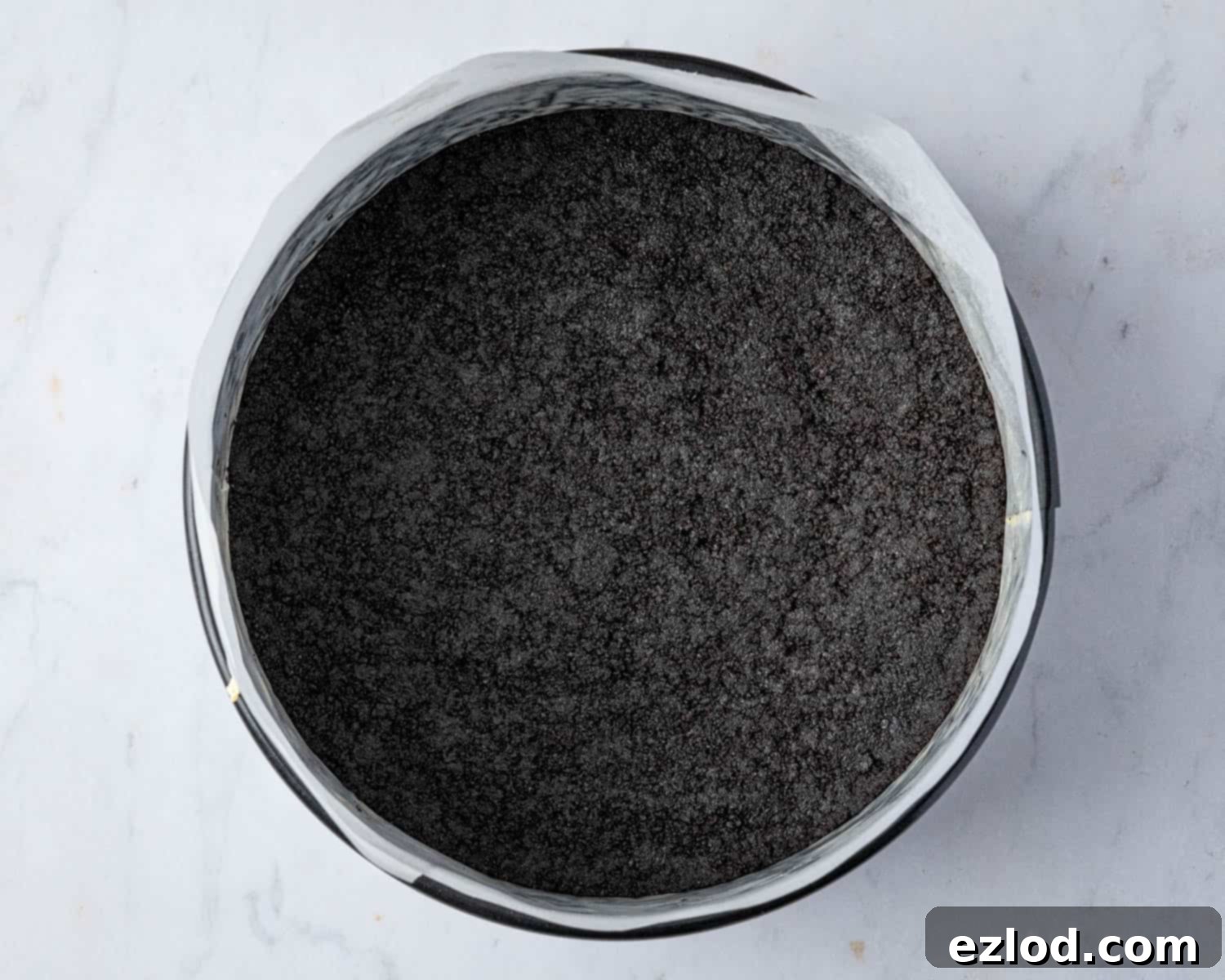 Velvet Vegan Chocolate Cheesecake 7 Step 3, the prepared cookie crust in the tin.