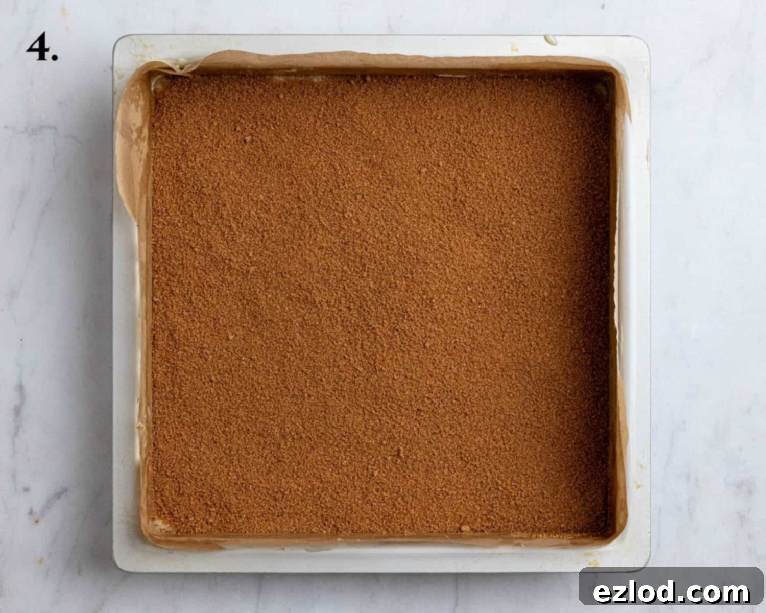Plant-Based Streusel Cake 8 Step 4, the batter topped with the cinnamon sugar in a cake tin.