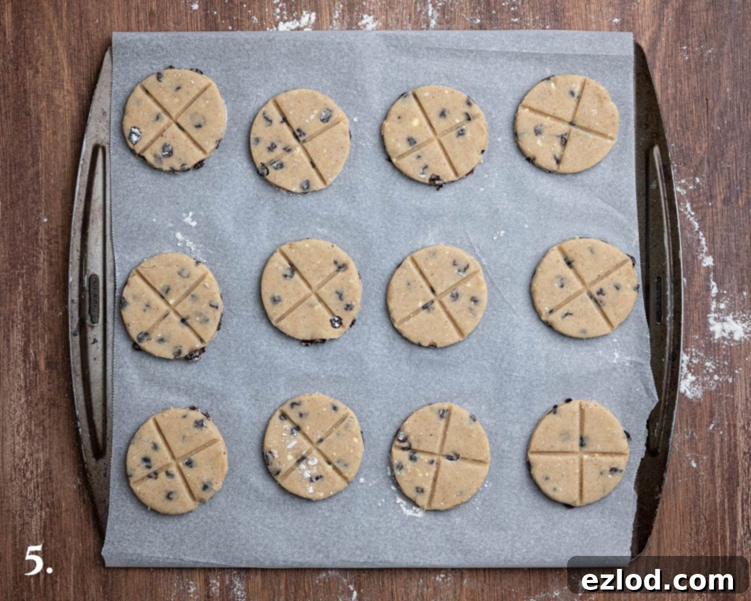 Homestyle Vegan Soul Cakes 9 Step 5, the soul cakes on a baking sheet marked with crosses.