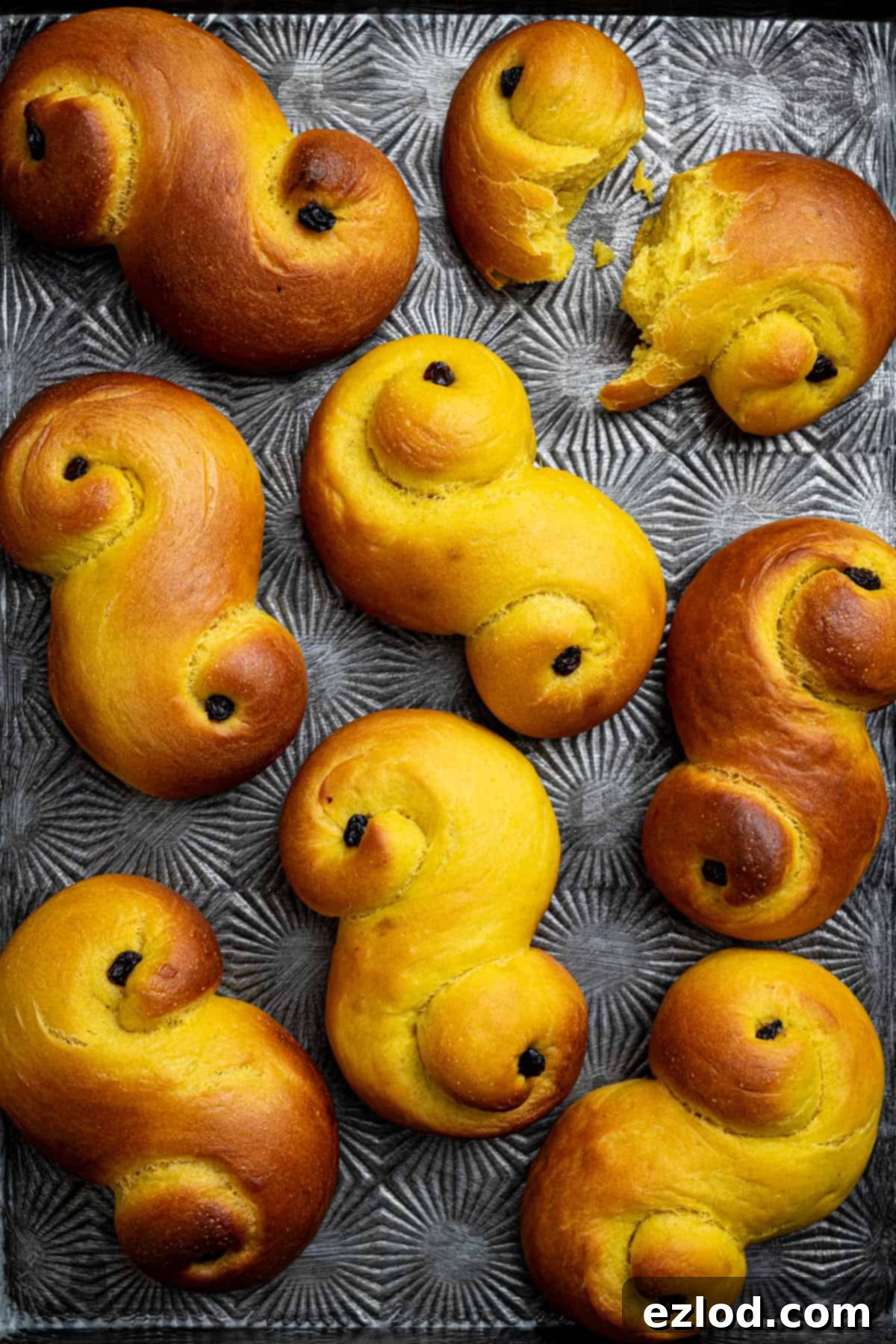 Plant-Based Saffron Buns for St. Lucia 15 Close up of vegan St. Lucia buns on a metal tray.