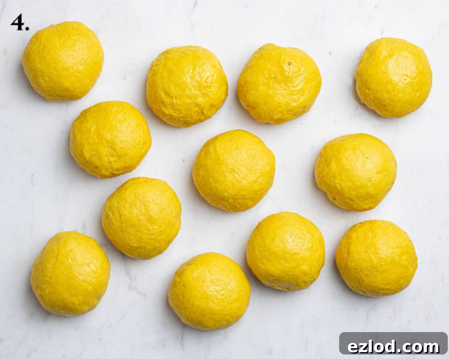 Plant-Based Saffron Buns for St. Lucia 10 Step 4, the dough portioned into balls.