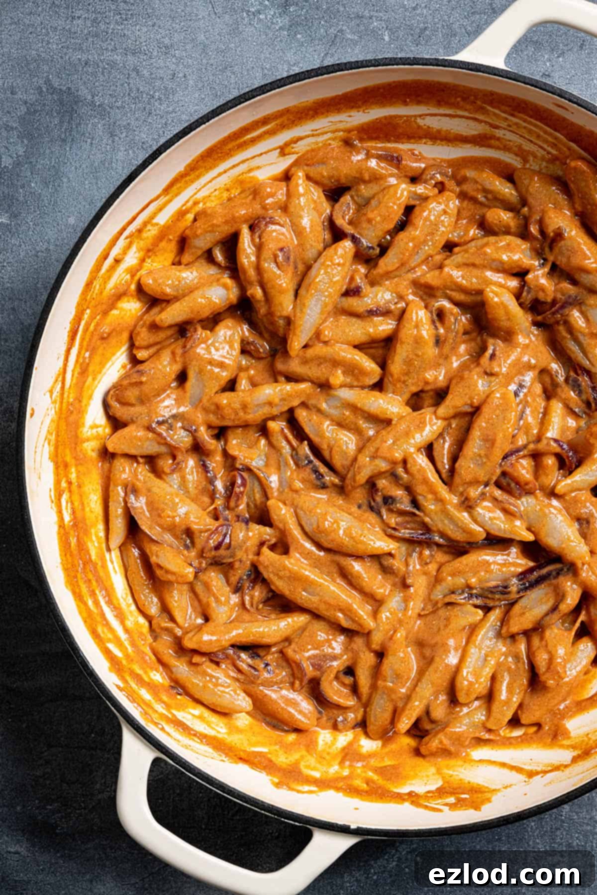 Velvety Gochujang Cream Pasta with Vegan Scissor Tofu 11 Scissor cut tofu noodles and creamy gochujang sauce in a pan, ready to be served.
