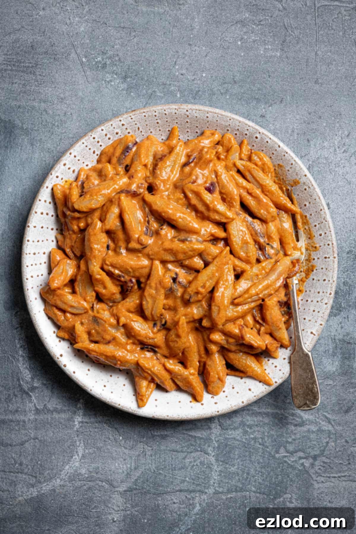 Velvety Gochujang Cream Pasta with Vegan Scissor Tofu 13 A plate of scissor cut tofu pasta with creamy gochujang sauce, ready to be eaten.