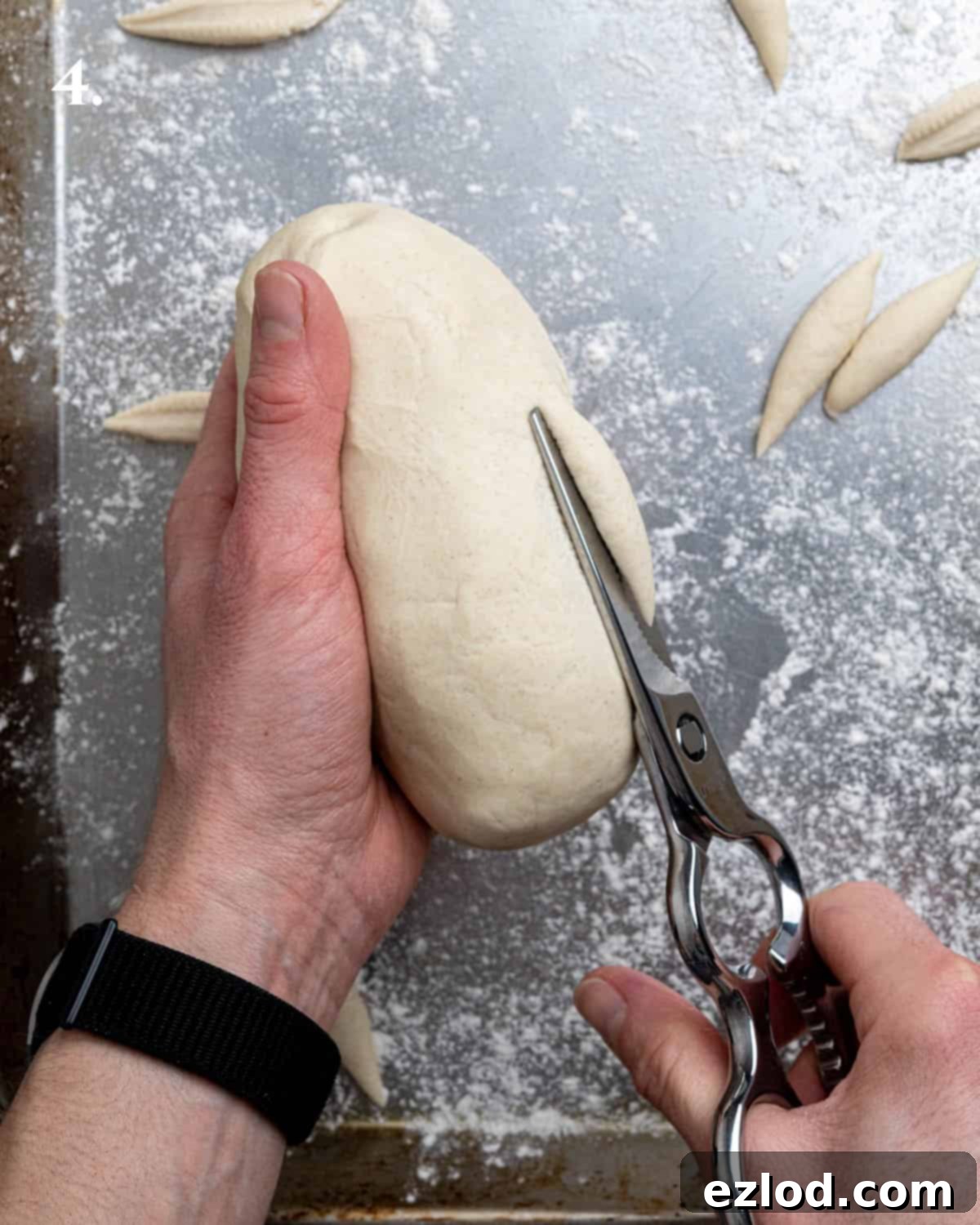 Velvety Gochujang Cream Pasta with Vegan Scissor Tofu 8 Step 4, hands holding kitchen scissors, actively cutting dough into small pieces.