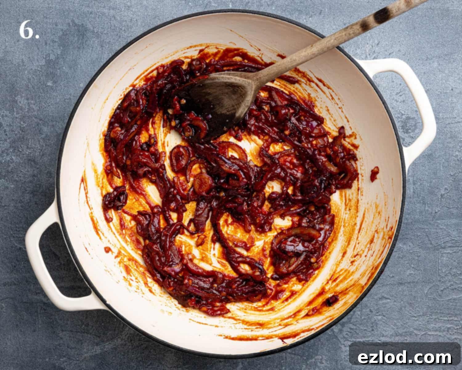 Velvety Gochujang Cream Pasta with Vegan Scissor Tofu 10 Step 6, the fried onion and garlic with gochujang paste and tomato puree in a pan.