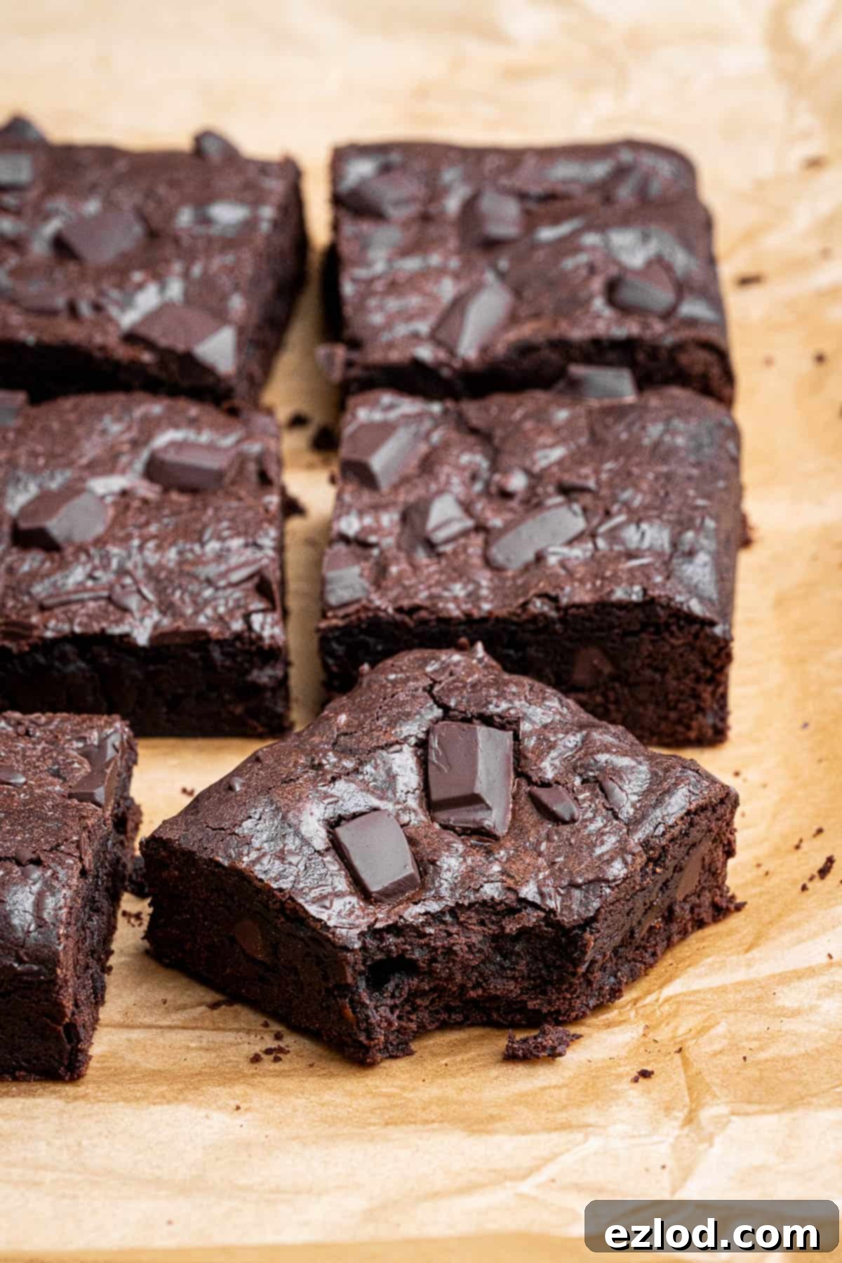 Vegan Chocolate Orange Fudge Brownies 4 Close up of a vegan chocolate orange brownie with a bite taken out of it.