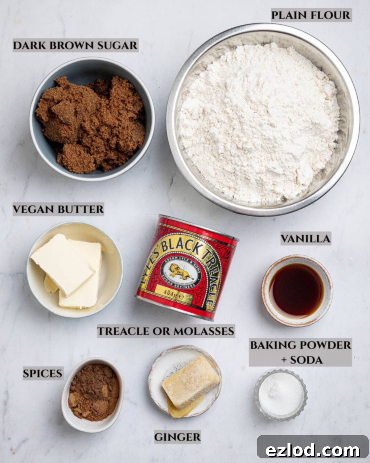 Plant-Based Jamaican Bulla Delight 3 A beautifully arranged overhead shot showcasing all the essential ingredients needed to bake delicious vegan Jamaican bulla cakes, including flour, sugar, spices, and wet ingredients in separate bowls.