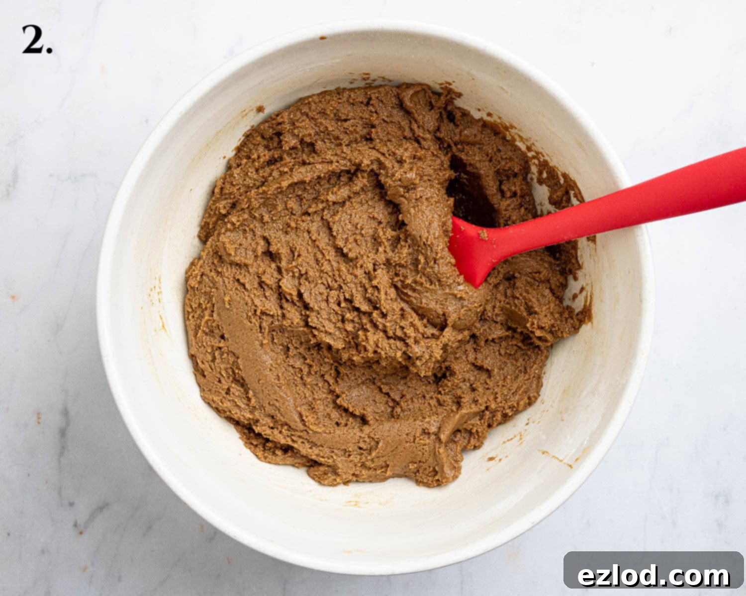 Plant-Based Jamaican Bulla Delight 6 Step 2 in bulla cake preparation: The soft, slightly sticky dough, enriched with spices and flour, in a mixing bowl, ready for chilling.