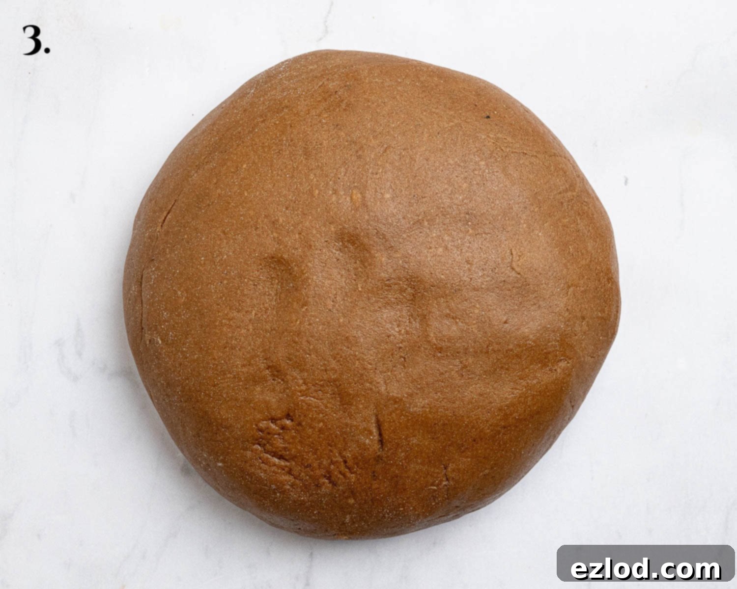 Plant-Based Jamaican Bulla Delight 7 Step 3: The bulla cake dough, after chilling and a brief knead, shaped into a smooth ball and resting in a bowl, prepared for rolling.