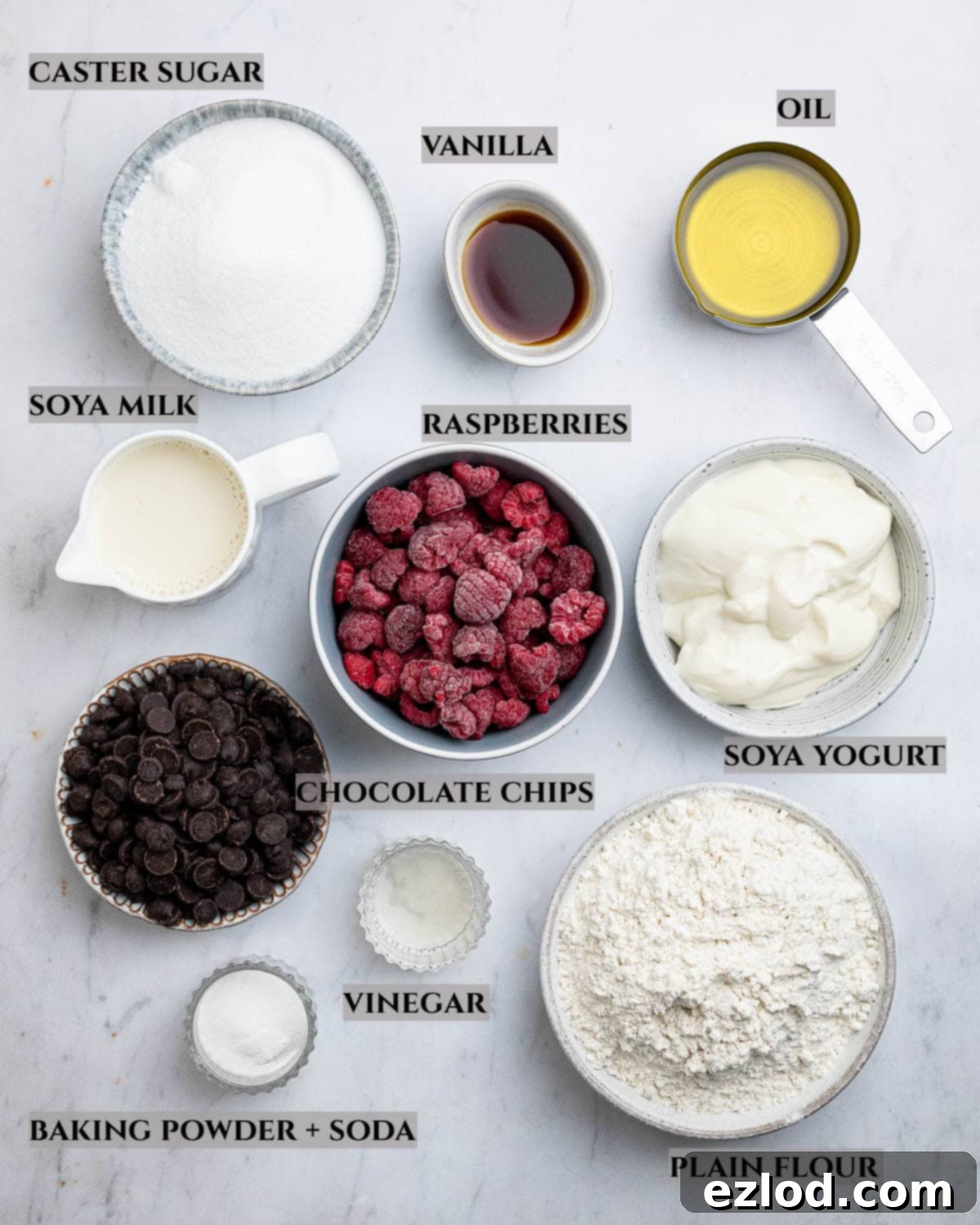 Plant-Based Chocolate Raspberry Muffins 3 A labelled photo of the ingredients needed to  make choc chip raspberry muffins.