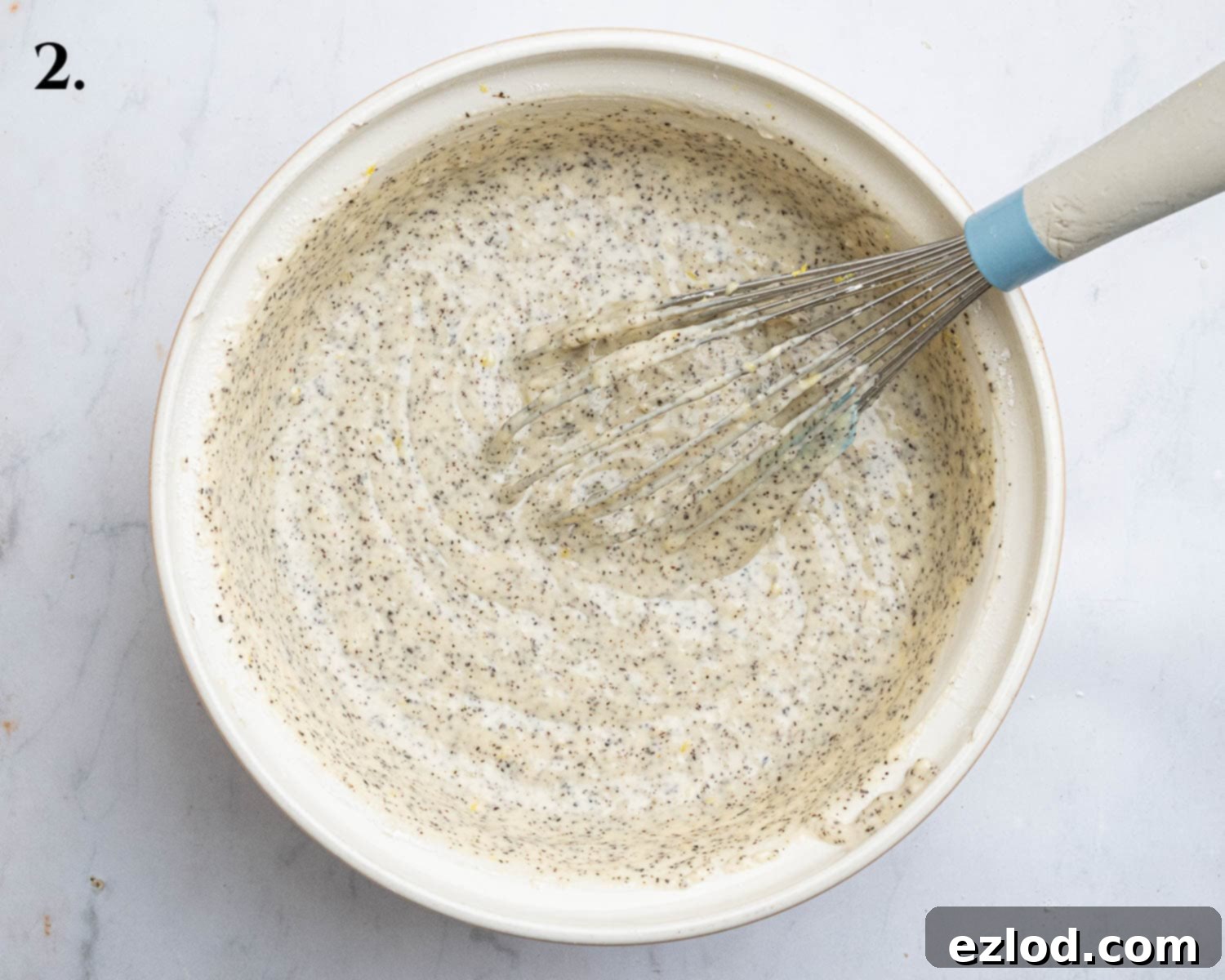 Zesty Vegan Earl Grey Lemon Cake 6 Step 2 in making vegan Earl Grey lemon cake: the dry ingredients, including cornflour, baking powder, baking soda, and salt, are whisked into the wet batter until just combined, followed by the plain flour.