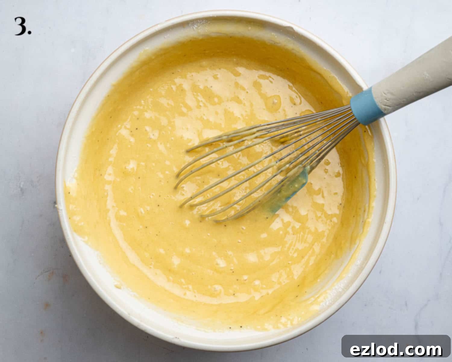 Luscious Vegan Passion Fruit Delight 7 Step 3 in making vegan passion fruit cake: The beautifully smooth and well-mixed cake batter in a bowl, showing no dry lumps, ready for the baking tin.