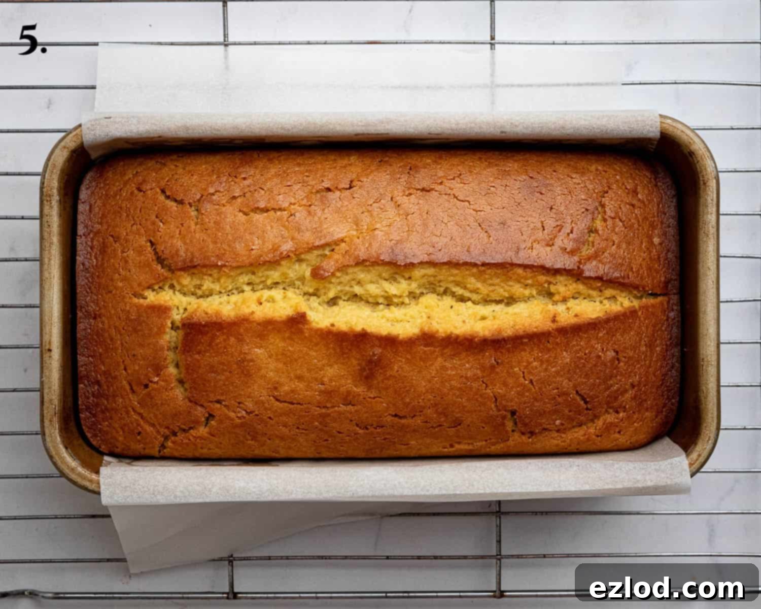 Luscious Vegan Passion Fruit Delight 9 Step 5 in making vegan passion fruit cake: The beautifully golden-brown baked loaf cake, risen and cracked down the center, freshly out of the oven.