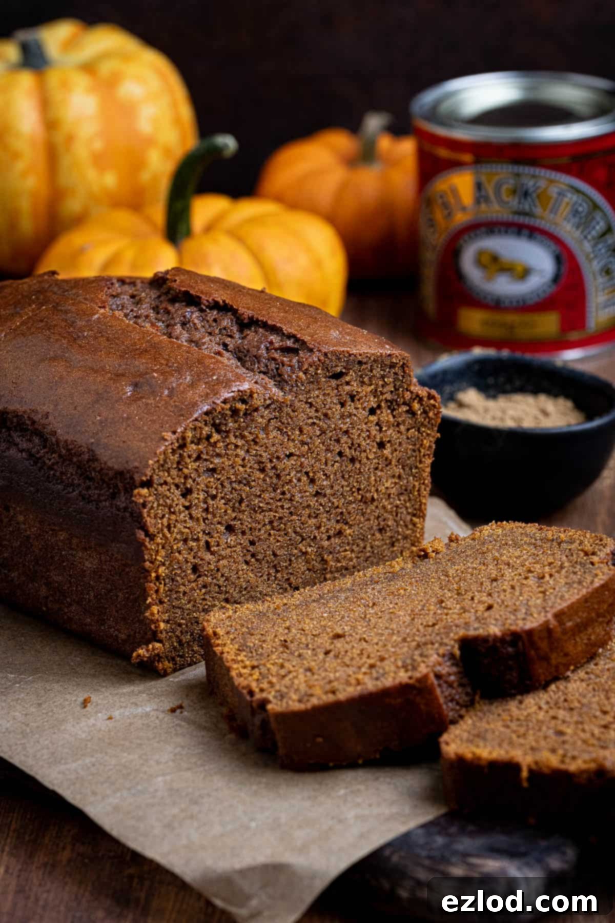 Vegan Pumpkin Gingerbread 4 Vegan pumpkin gingerbread with mini pumpkins and a tin of treacle.