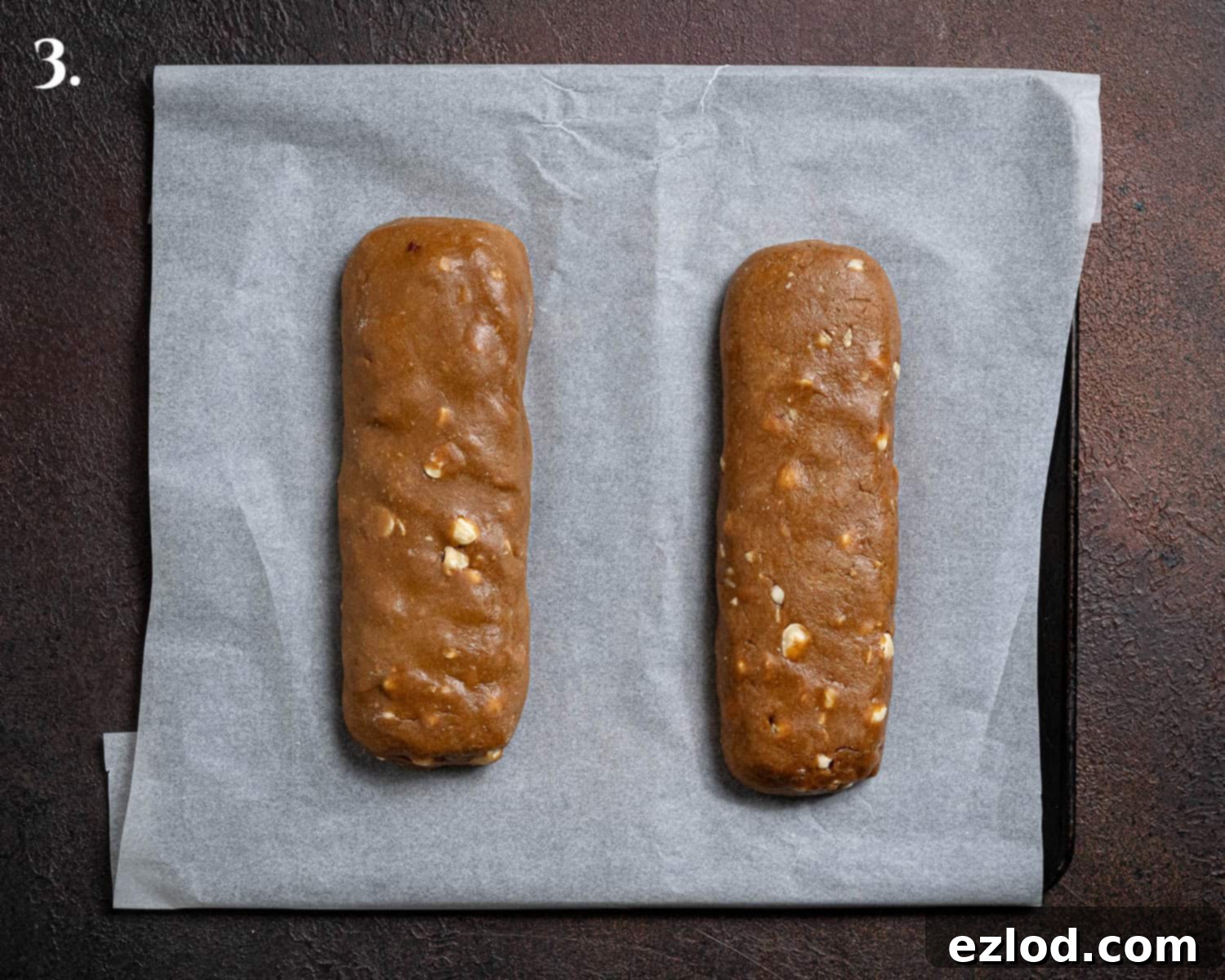 Plant-Based Coffee Hazelnut Biscotti 7 Step 3, the shaped logs on a baking sheet.