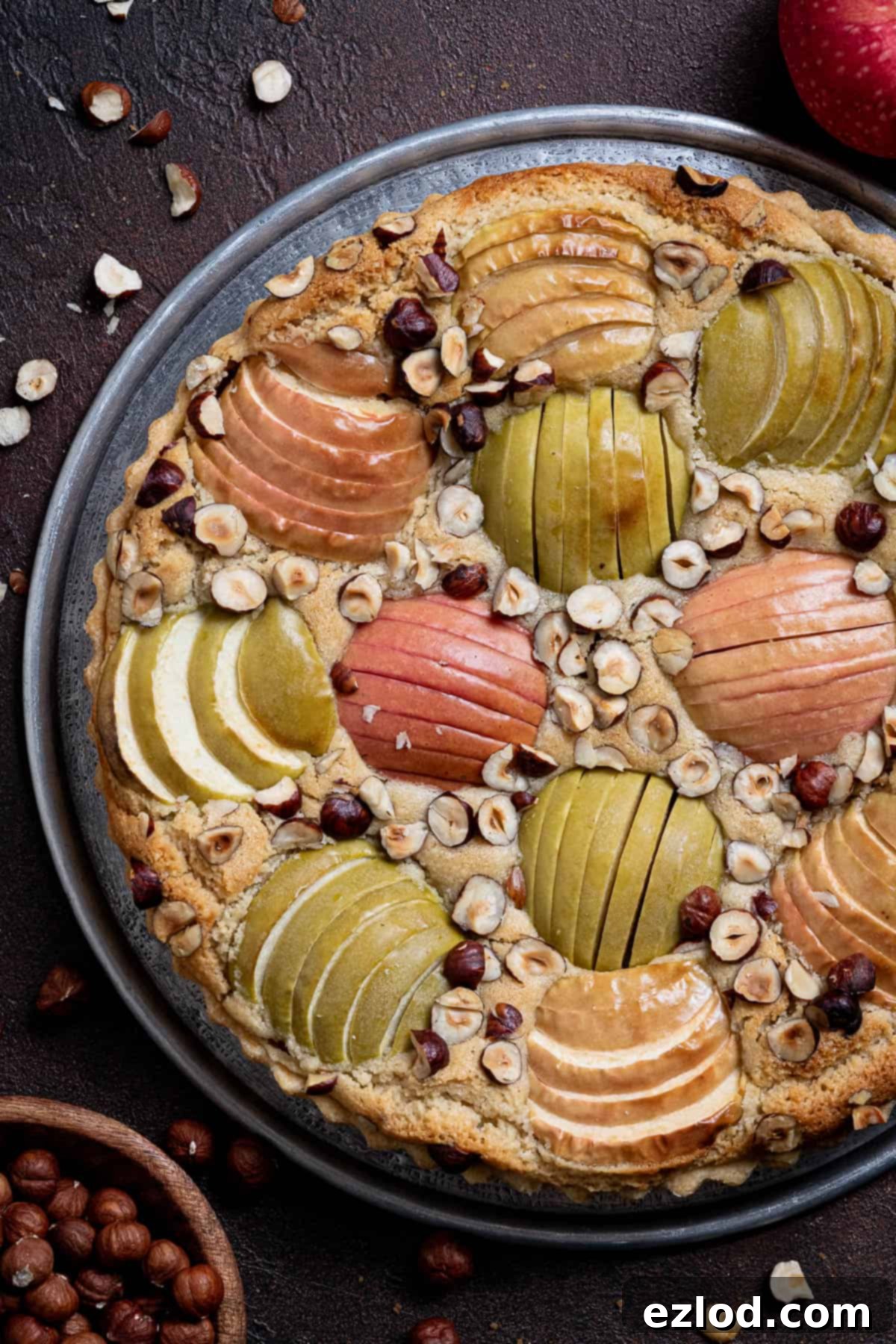 Elegant Vegan Apple Hazelnut Frangipane Tart 17 A close-up of the beautifully baked vegan apple hazelnut frangipane tart, showcasing its golden crust and delicious filling.