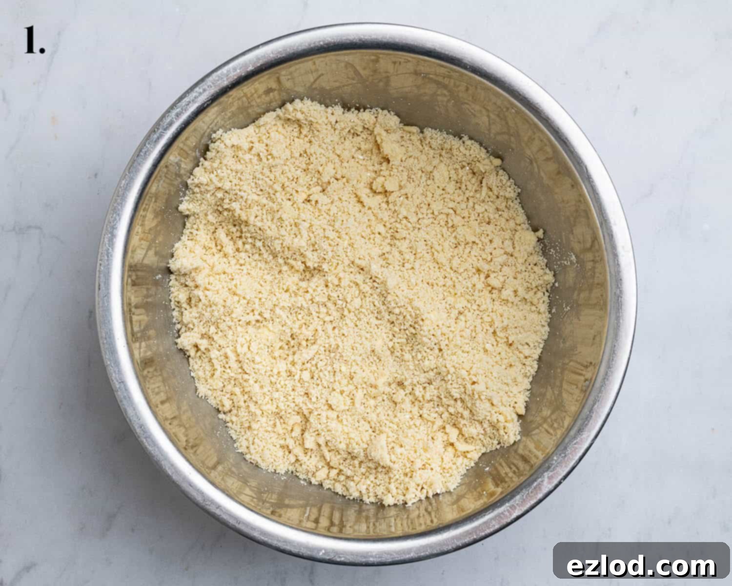 Elegant Vegan Apple Hazelnut Frangipane Tart 5 Step 1 in making the pastry: cold vegan butter is rubbed into the dry flour, ground almonds, icing sugar, and salt until crumbly.