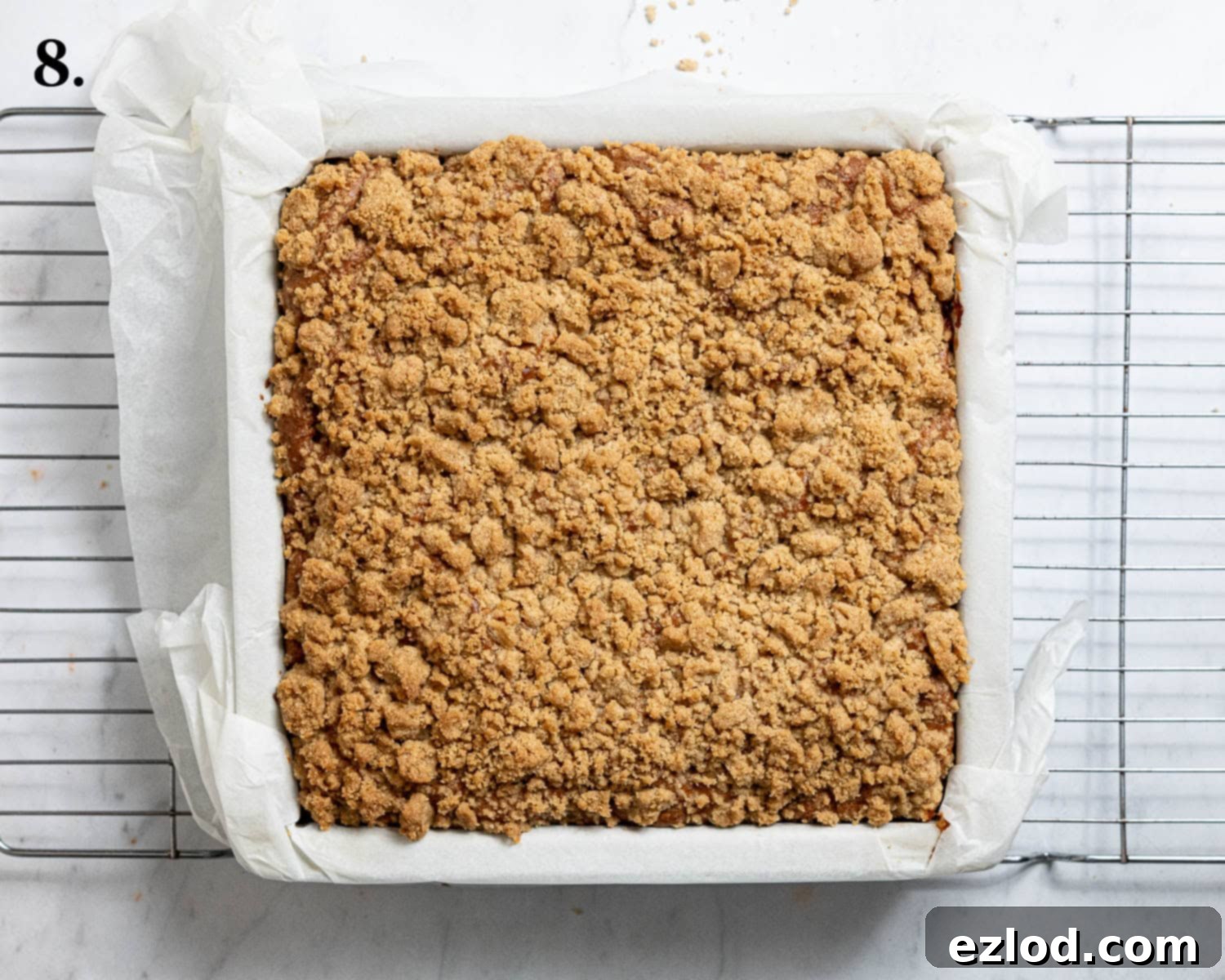 Spiced Vegan Apple Streusel Cake 12 Step 8, the golden-brown baked cake cooling in the tin, streusel perfectly crisp.