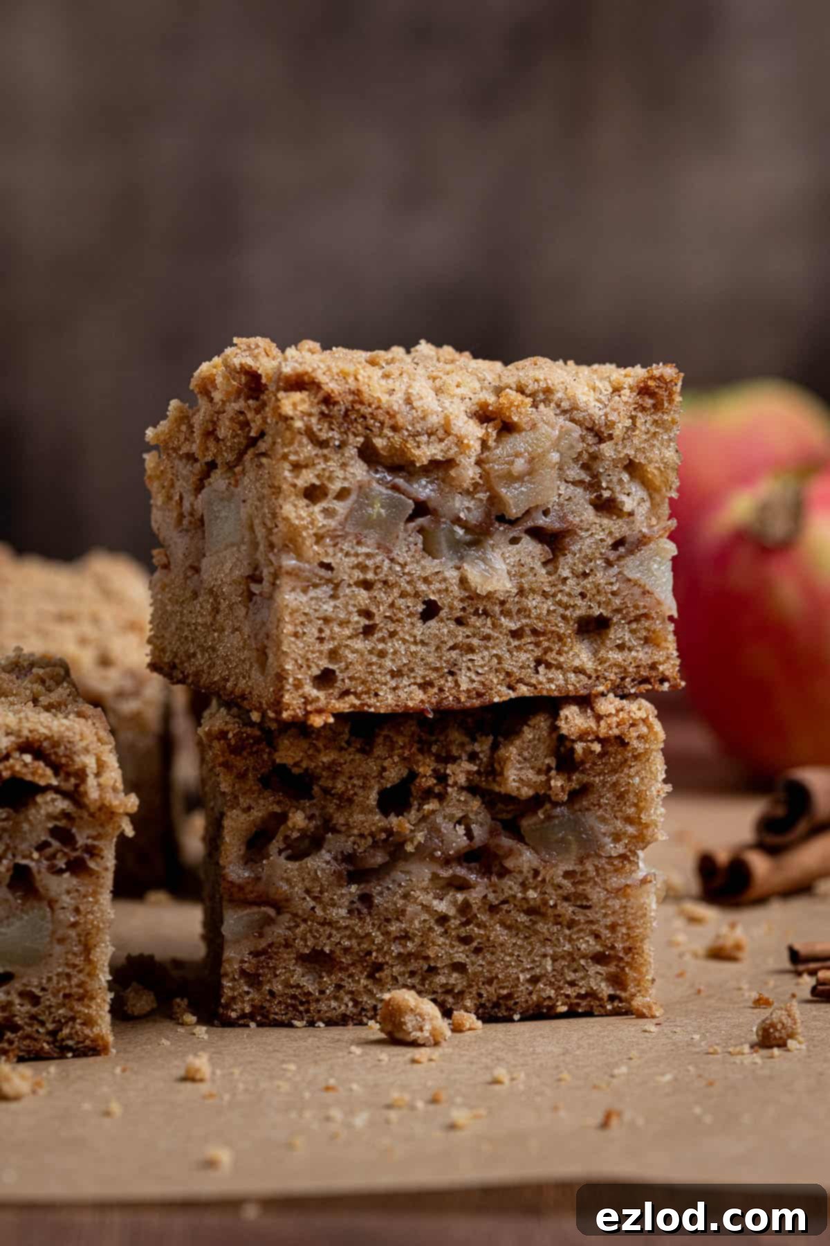 Spiced Vegan Apple Streusel Cake 13 A beautifully stacked pair of squares of vegan apple crumb cake, showing off the layers of cake, apple, and streusel.