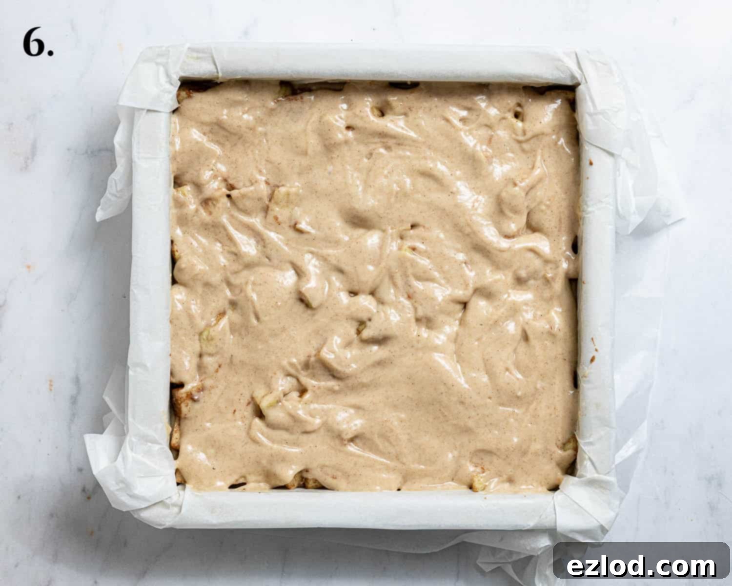 Spiced Vegan Apple Streusel Cake 10 Step 6, the apples topped with the remaining cake batter, ready for the streusel.