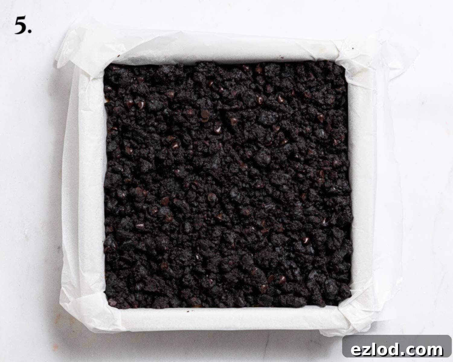 Step 5, the cake with the crumb topping before baking.