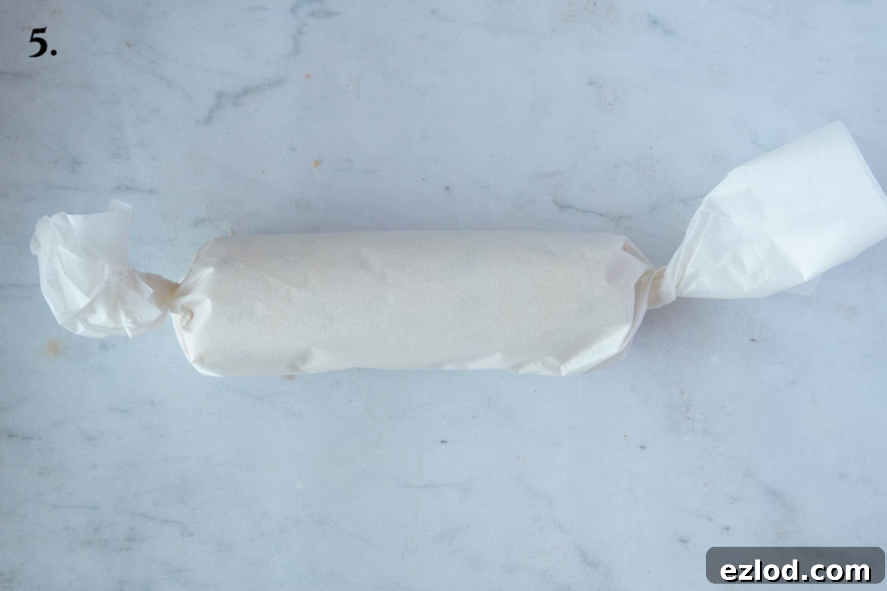 Buttery Ginger Shortbread 9 Step 5, the log of dough wrapped in baking parchment.