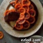 Aromatic Chocolate Olive Oil Rosemary Cake with Candied Blood Oranges 6 A tempting visual of the Chocolate, Olive Oil and Rosemary Cake with Candied Blood Oranges, promising a moist, aromatic, and delicious baking experience.