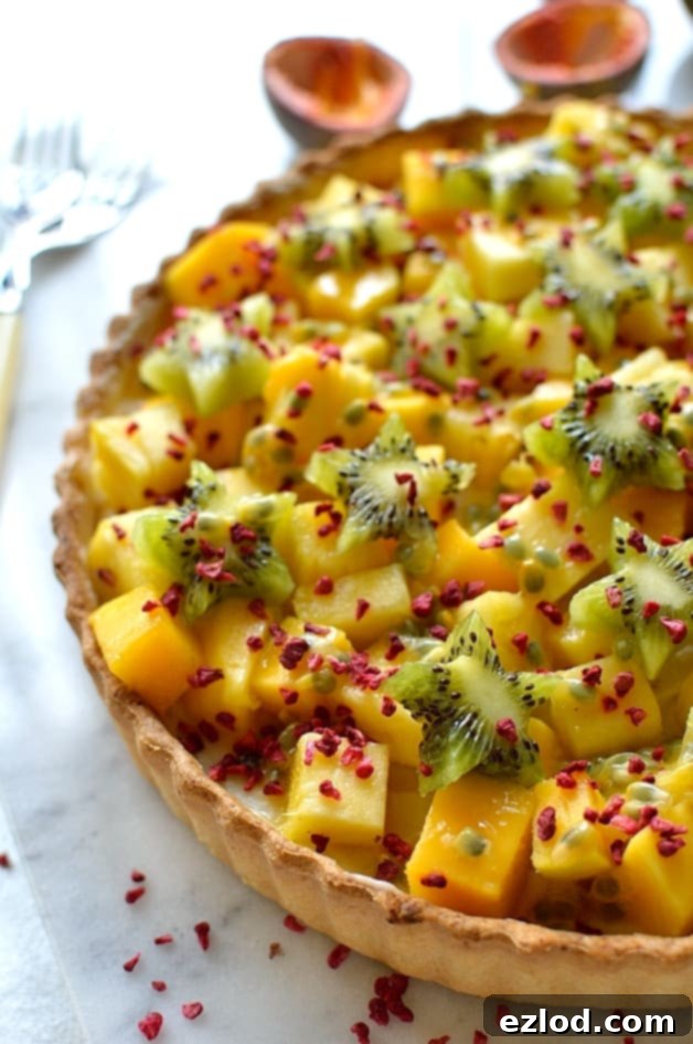 Vegan Tropical Fruit Coconut Tart 3 Tropical fruit coconut tart - crispy coconut pastry filled with coconut pastry cream, mango, pineapple, kiwi & passion fruit