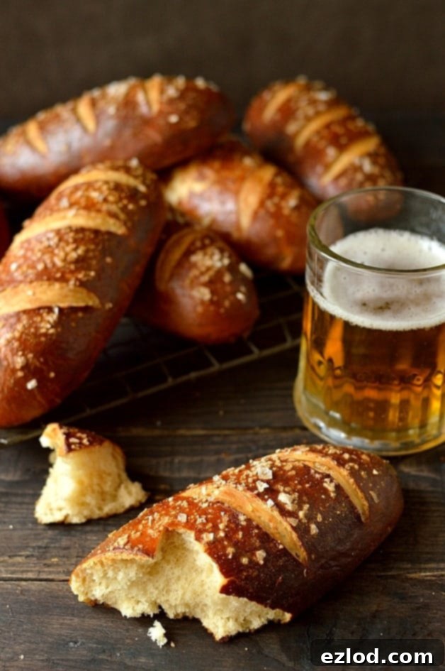Brewmaster's Pretzel Hot Dog Buns 2 Freshly baked beer pretzel hot dog buns on a cooling rack