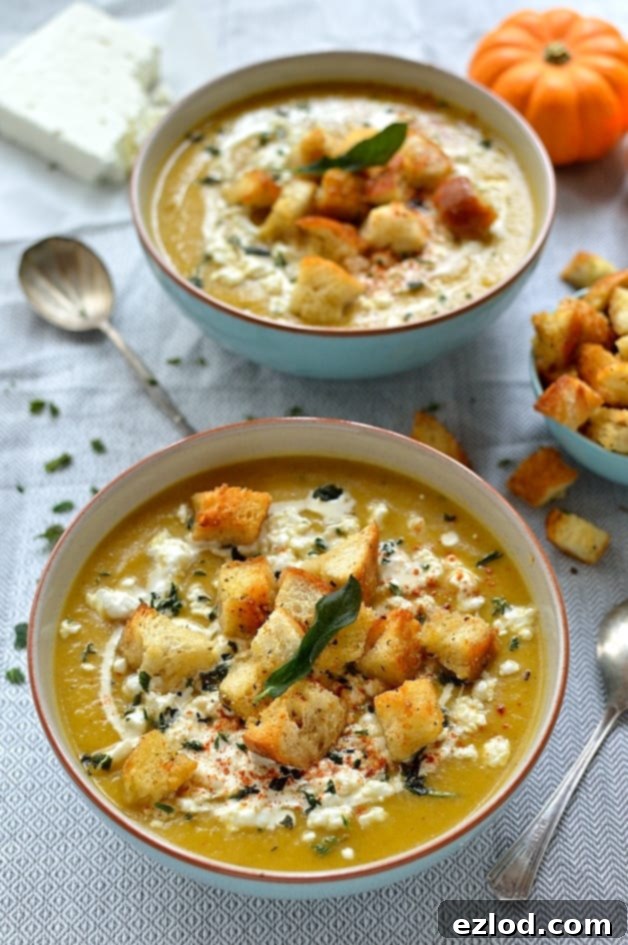 Velvet Pumpkin Soup with Feta, Garlic Croutons, and Fried Sage 7 An inviting bowl of easy spiced roast pumpkin soup, topped generously with homemade garlicky croutons, creamy feta cheese, and crispy fried sage for a satisfying meal.