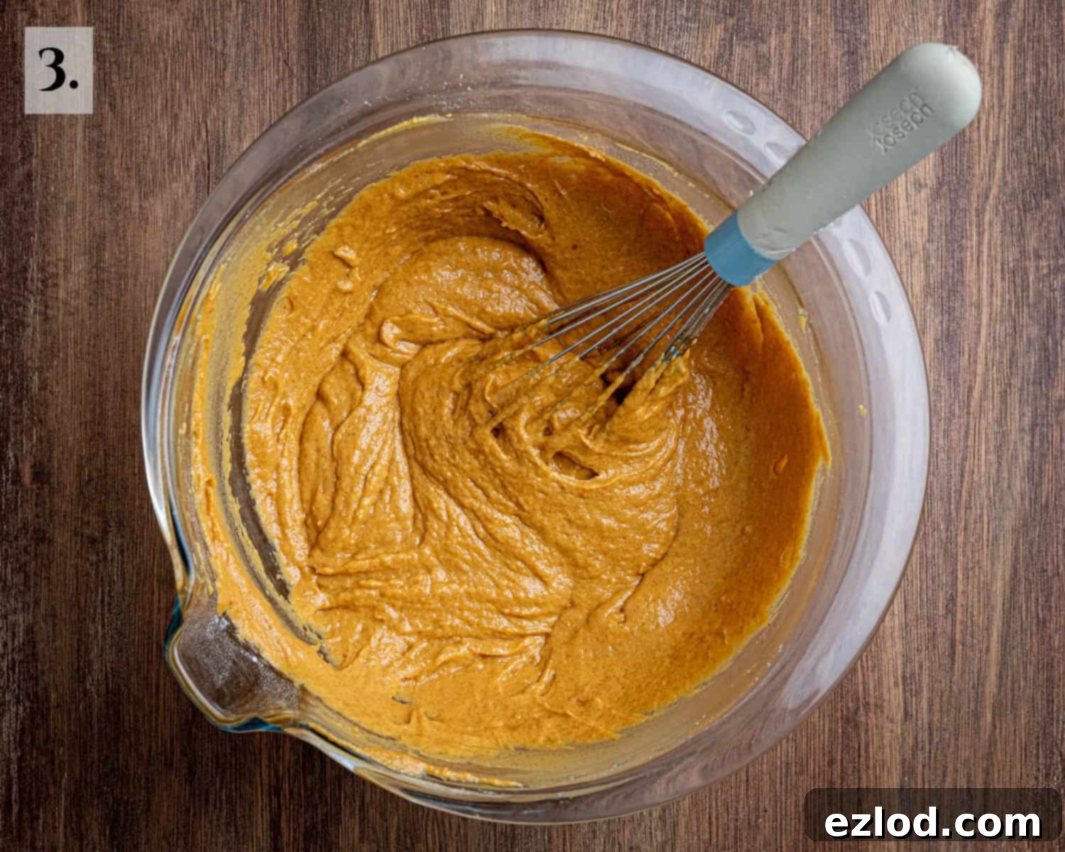 Spiced Vegan Pumpkin Streusel 7 Step 3: The finished, smooth, and richly colored cake batter is shown in a mixing bowl, ready to be poured into the tin.