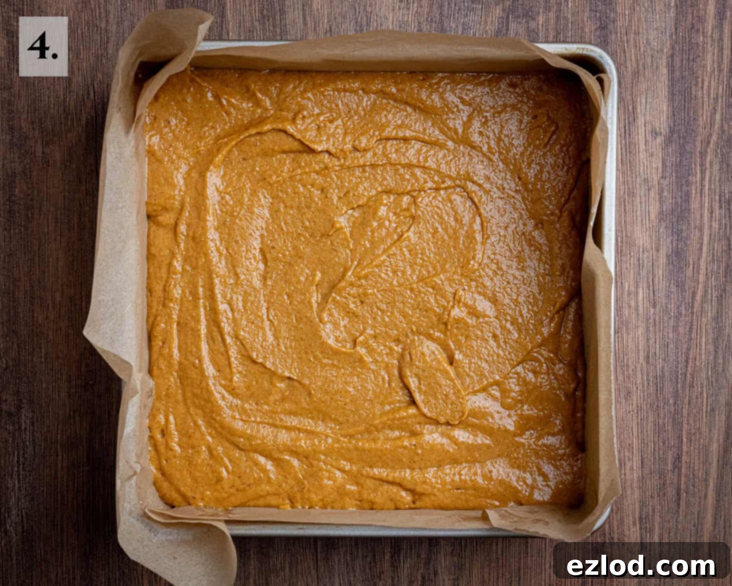 Spiced Vegan Pumpkin Streusel 8 Step 4: The smooth cake batter has been poured and spread evenly into the lined square baking tin, awaiting its topping.