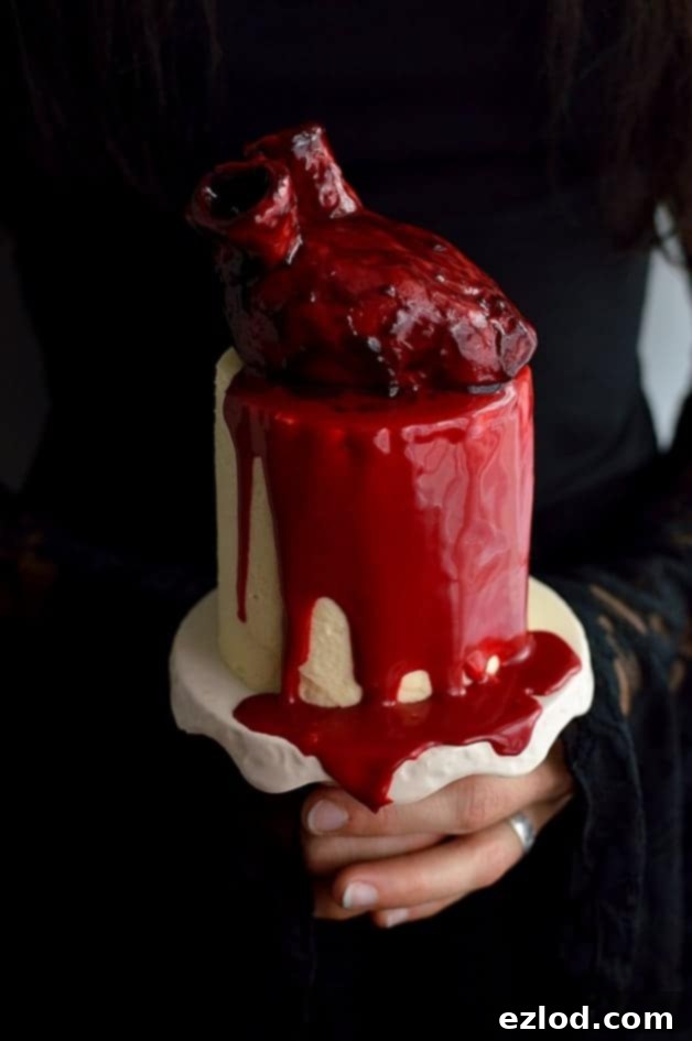 Haunted Heart Halloween Cupcakes 2 Mini bleeding heart Halloween cakes - mini red velvet layer cakes with cooked flour frosting, bloody heart cakes and gananche 'blood'; ideal for Halloween!