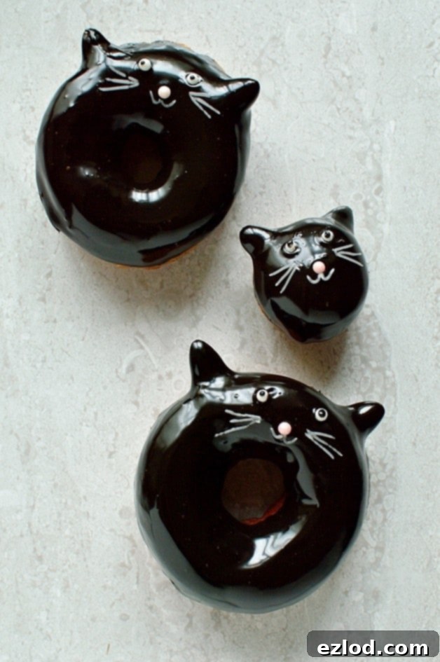 Black Cat's Midnight Chocolate Rings 5 Chocolate glazed fried doughnuts with a cute (and easy) black cat design, a perfect treat for Halloween!