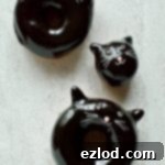 Black Cat's Midnight Chocolate Rings 6 Chocolate glazed fried doughnuts with a cute (and easy) black cat design, a perfect treat for Halloween!