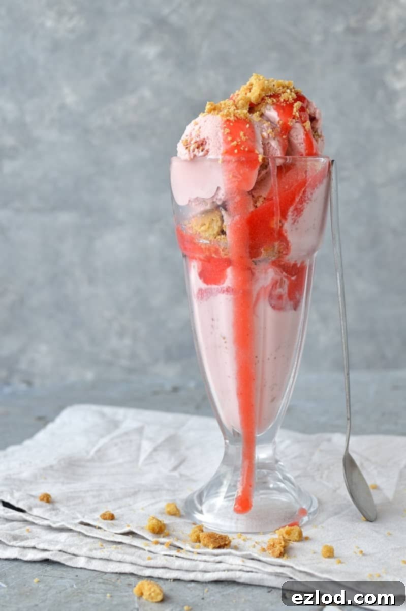 Rhubarb Strawberry Crumble Crunch Ice Cream 3 Roasted rhubarb and strawberry crumble ice cream - a delicious fruity ice cream filled with chunks of buttery crumble and topped with a tangy rhubarb strawberry sauce.