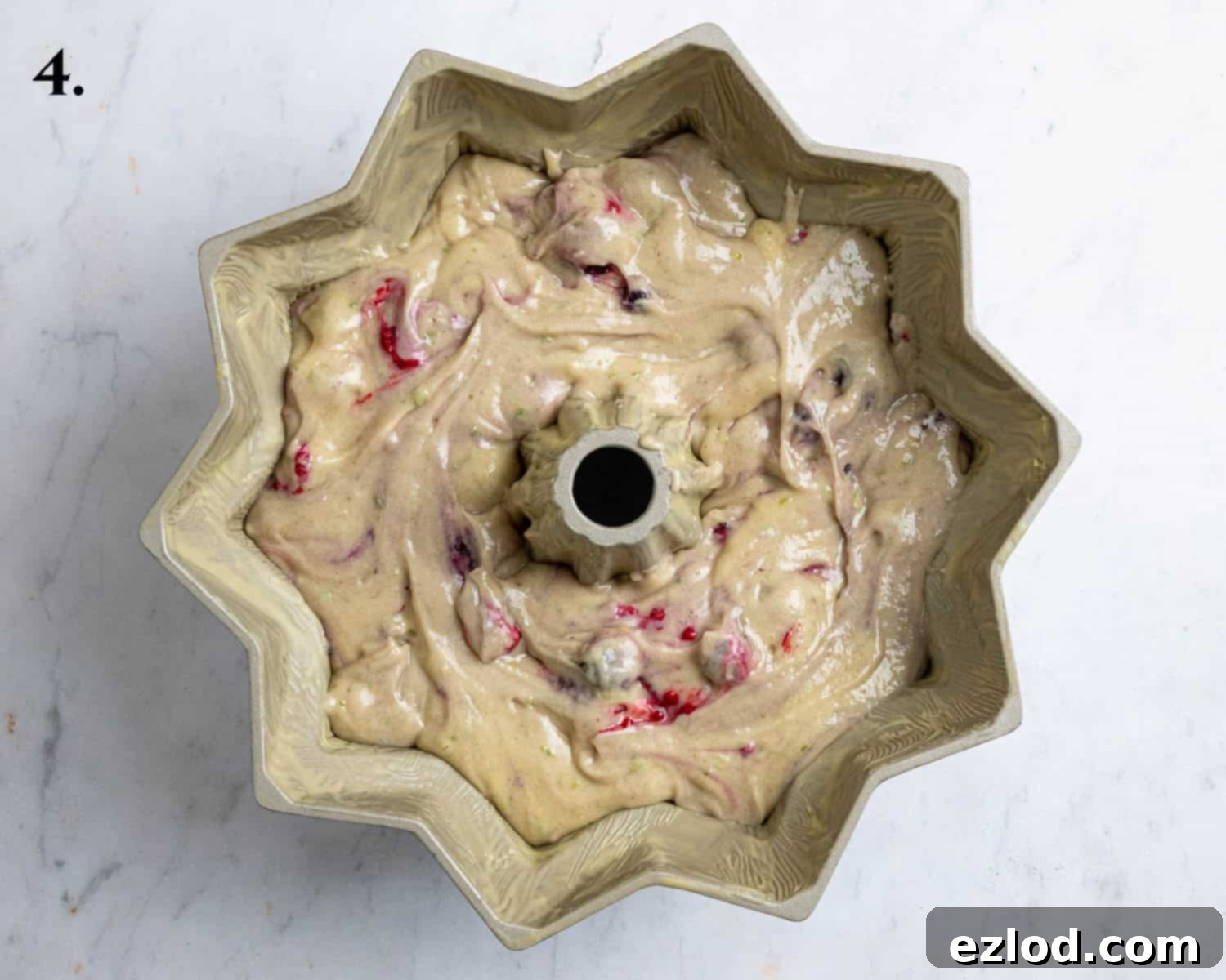 Vegan Berry Lime Bundt Cake 8 Step 4 in making berry lime bundt cake: the smooth, berry-studded batter neatly transferred into a greased bundt tin, ready for baking.