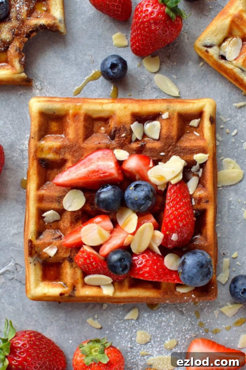 Decadent Chocolate Almond Waffles 4 chocolate chip almond waffles - fluffy waffles made with ground almonds and filled with chocolate chips; perfect for an indulgent breakfast or brunch.