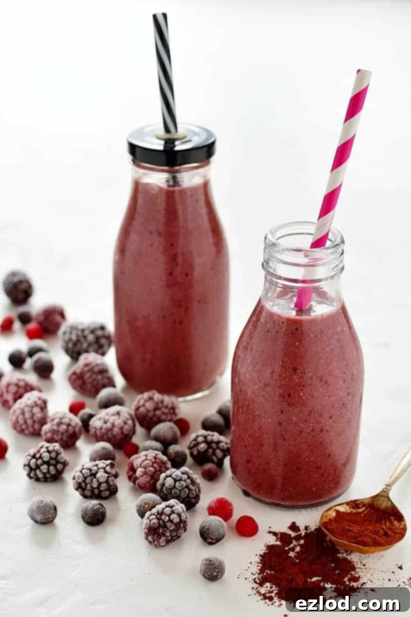 Berry Cocoa Dream 1 Rich chocolate berry smoothie in a glass with fresh berries