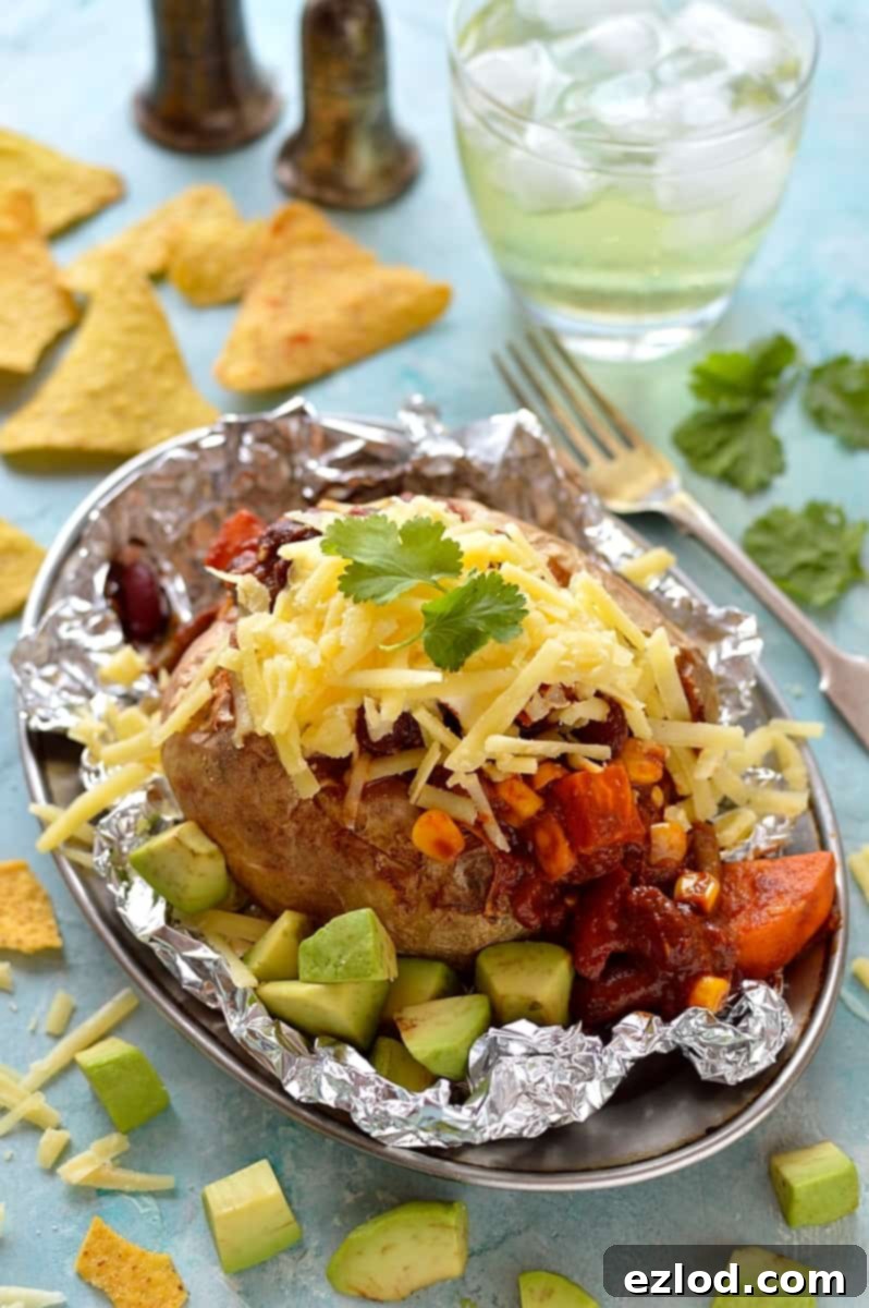 Effortless Veggie Chili and 5 Smart Leftover Dishes 10 Veggie chilli topped baked potato with sour cream and cheese, a classic and comforting leftover meal.