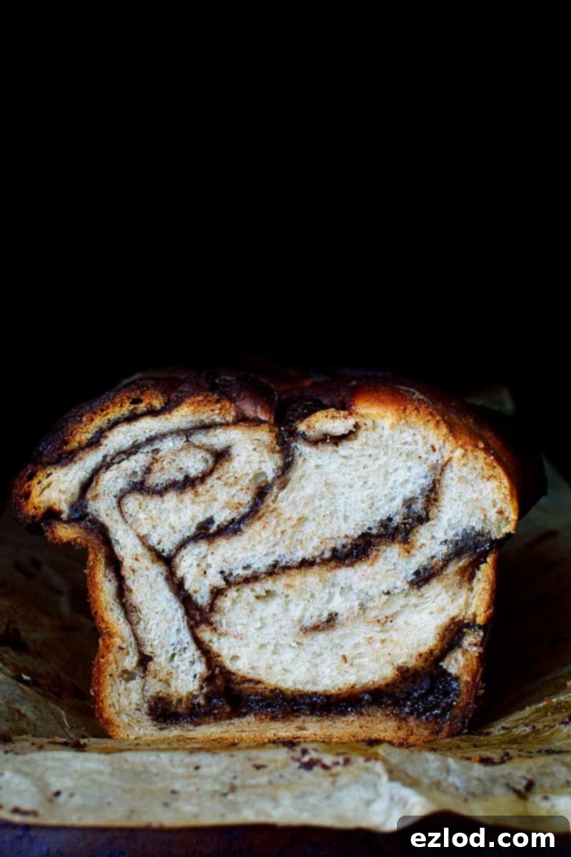 Marbled Nutella Banana Yeast Bread 1 Nutella Swirled Banana Yeast Bread - Soft yeasted banana bread with a generous swirl of Nutella, showcasing its delicious texture.