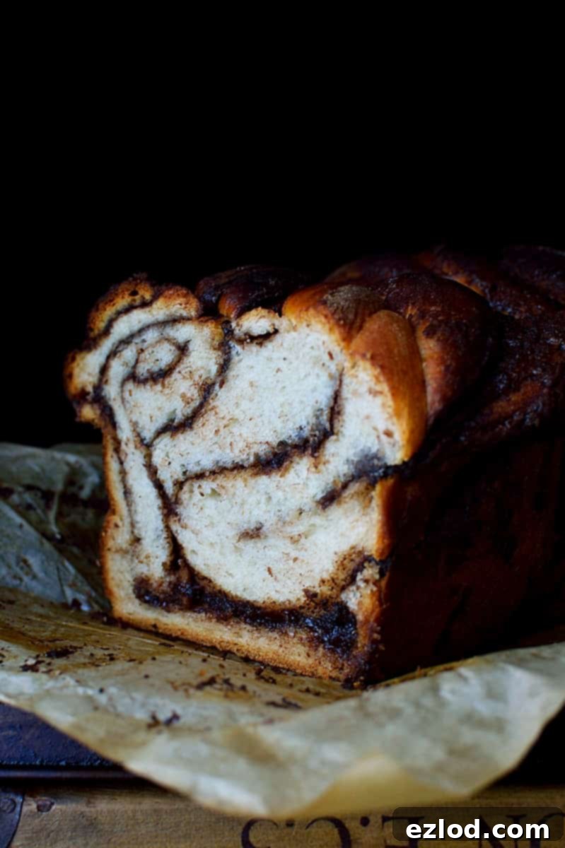 Marbled Nutella Banana Yeast Bread 3 Slice of Nutella Swirled Banana Yeast Bread with visible Nutella layers and a soft crumb.