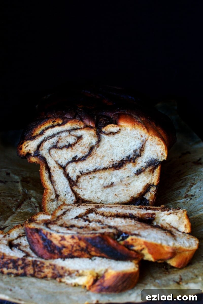 Marbled Nutella Banana Yeast Bread 4 A close-up of a golden brown Nutella Swirled Banana Yeast Bread loaf, fresh from the oven.