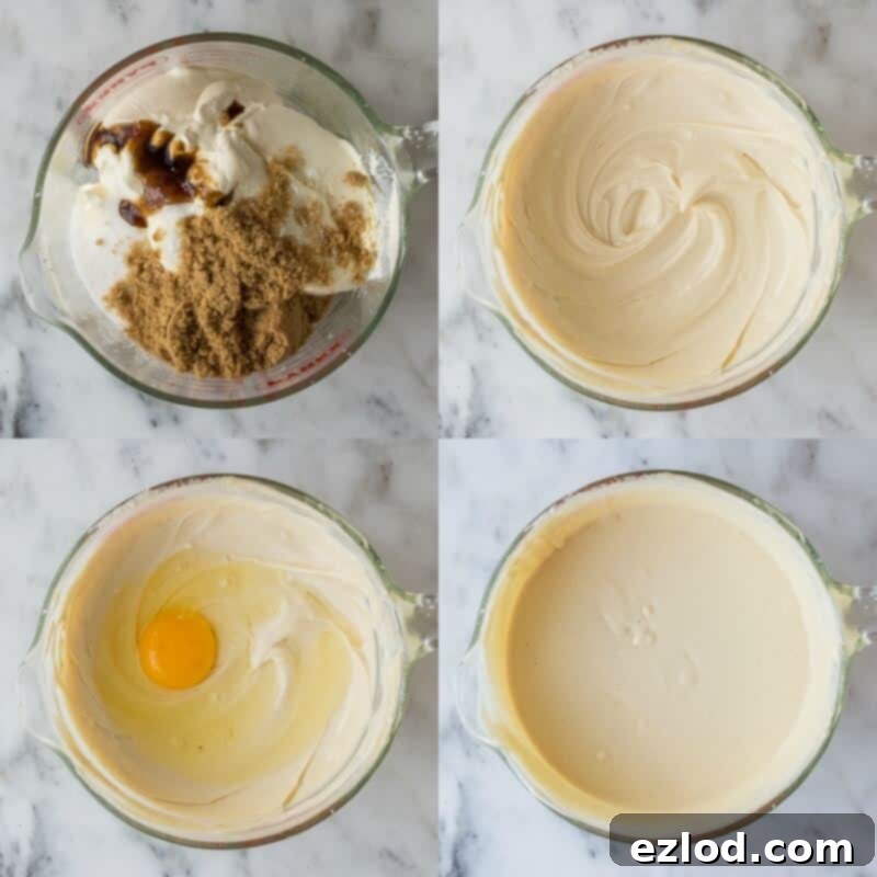 Pecan Praline Cheesecake 7 Close-up view of the smooth, creamy pecan pie cheesecake filling mixture in a large bowl, after all ingredients, including eggs, have been whisked together, ready to be poured over the crust.