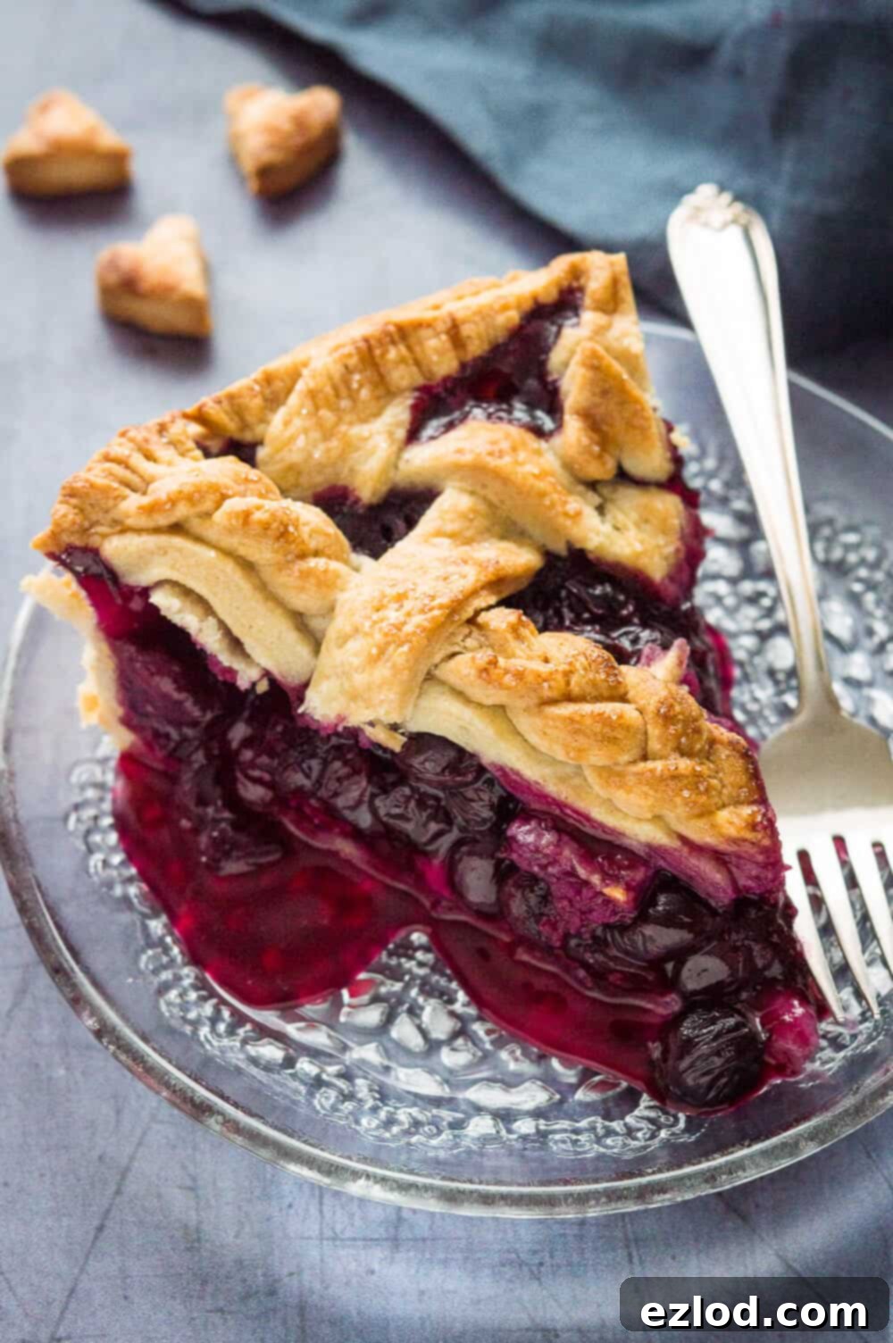 Vegan Blueberry Pie with a Flaky Coconut Oil Crust 5 Side view of a single slice of vegan lattice-topped blueberry pie with coconut oil pastry