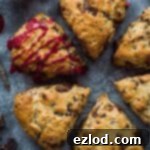 Decadent Vegan Chocolate Raspberry Scones 10 six vegan/dairy free coconut oil chocolate raspberry scones, one drizzled with raspberry glaze.