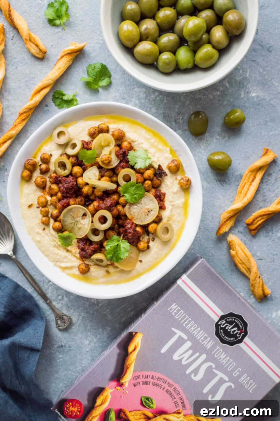 Hummus Bowl with Crispy North African Chickpeas and Fiery Caraway Jam 3 Spicy loaded hummus with crispy chickpeas, olives and Arden's mediterranean tomato and basil twists