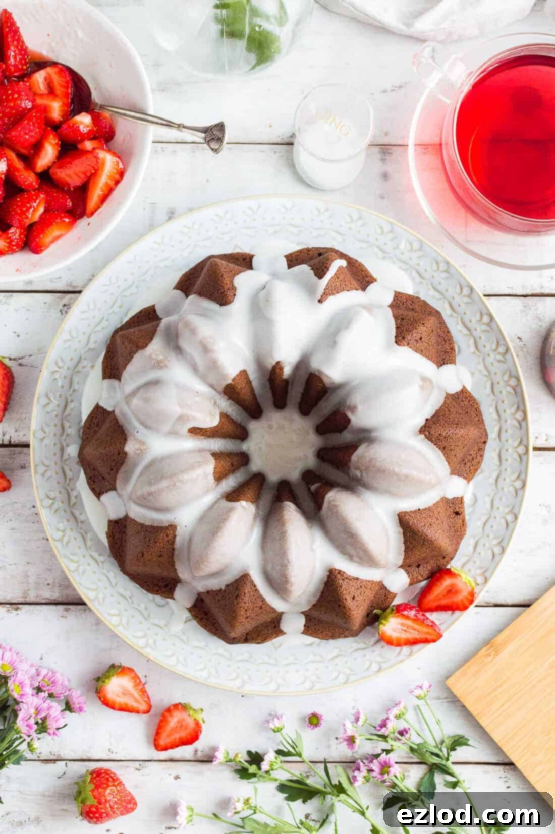 Vegan Ginger Bundt with Zesty Lime Drizzle and Sweet Strawberries 2 Vegan ginger bundt cake with lime glaze and macerated strawberries – a moist, spicy, easy to make cake served with juicy strawberries; perfect for afternoon tea! #gingerbread #vegan #vegancake #veganbaking #dairyfree #eggfree #bundtcake
